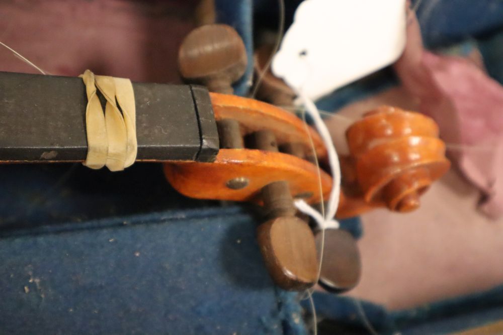 A French 3/4 size violin, Stradivarius label, with bow and accessories, in a case
